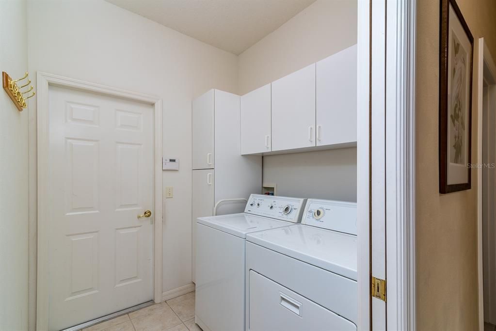 The laundry room is located between the kitchen and the attached 2 car garage. Washer and dryer stay.