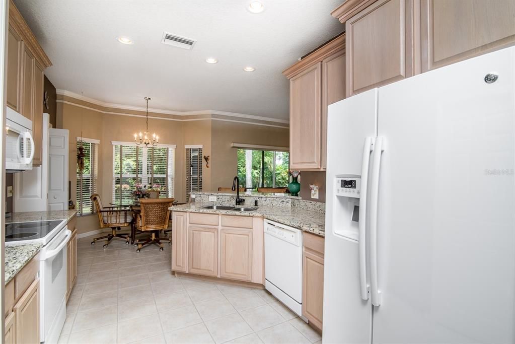 Upgraded appliances include a newer refrigerator and microwave.