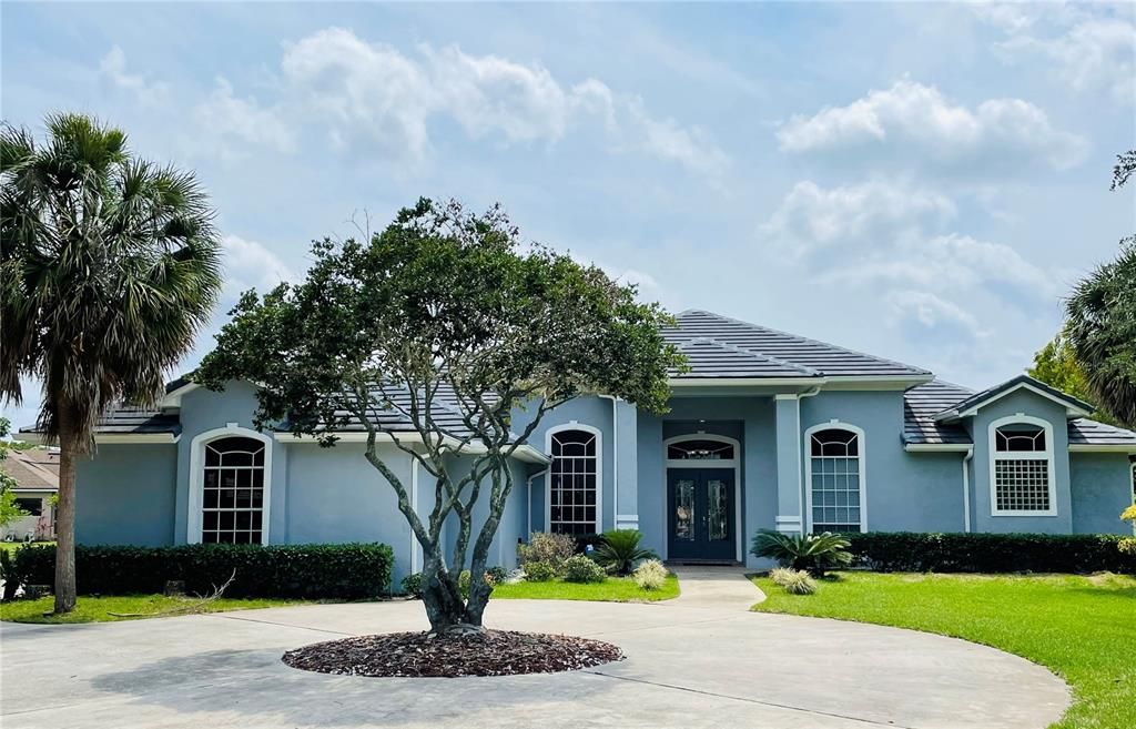 Front of the house with extended driveway