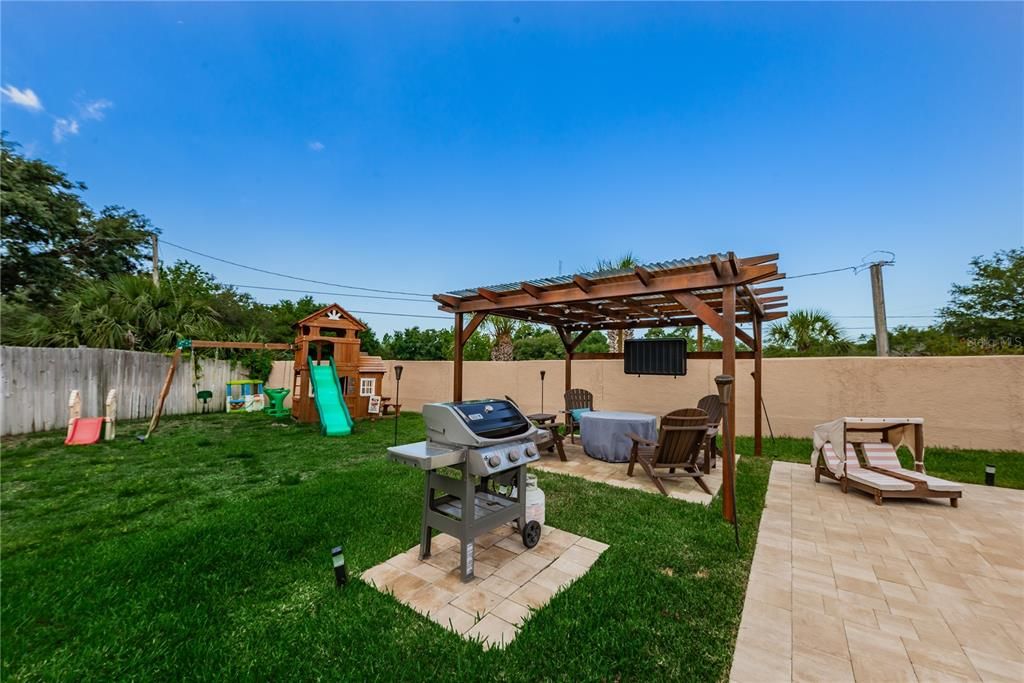 Yard View of Pergola and Grilling Area