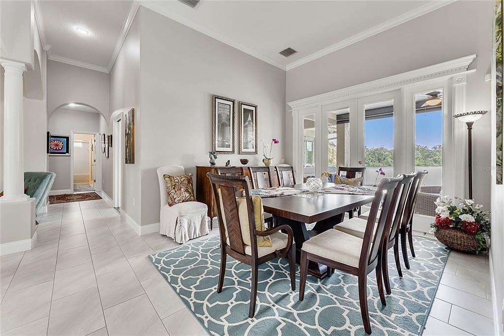Formal dining room or living room overlooking pool and lake