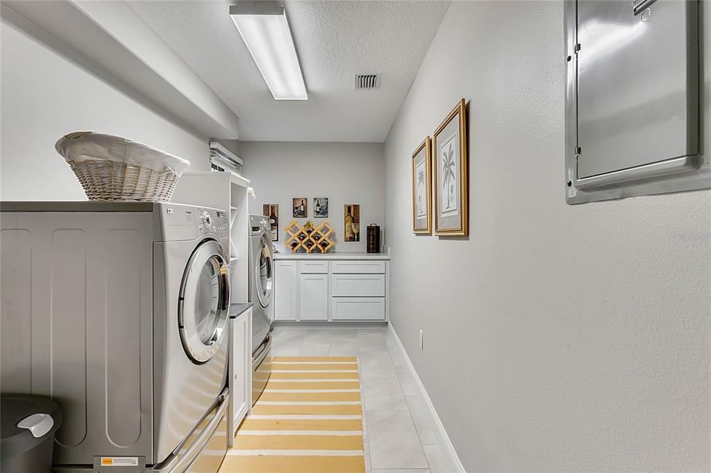 Oversized 18x7 Laundry room with storage/gift wrap station.  Also room for doggie apartment (not shown)
