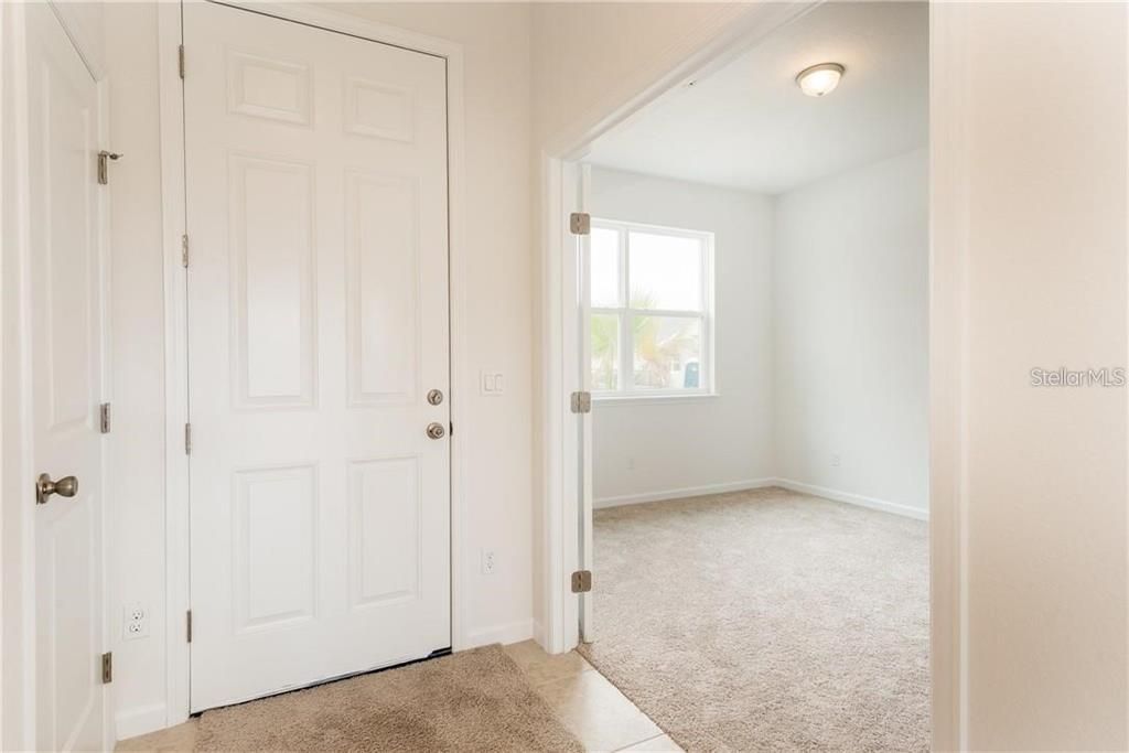 Foyer/Entryway Leading into Front Bedroom