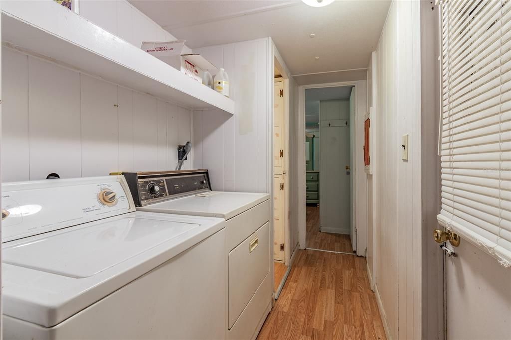 Laundry area is between bedroom 1 and bathroom