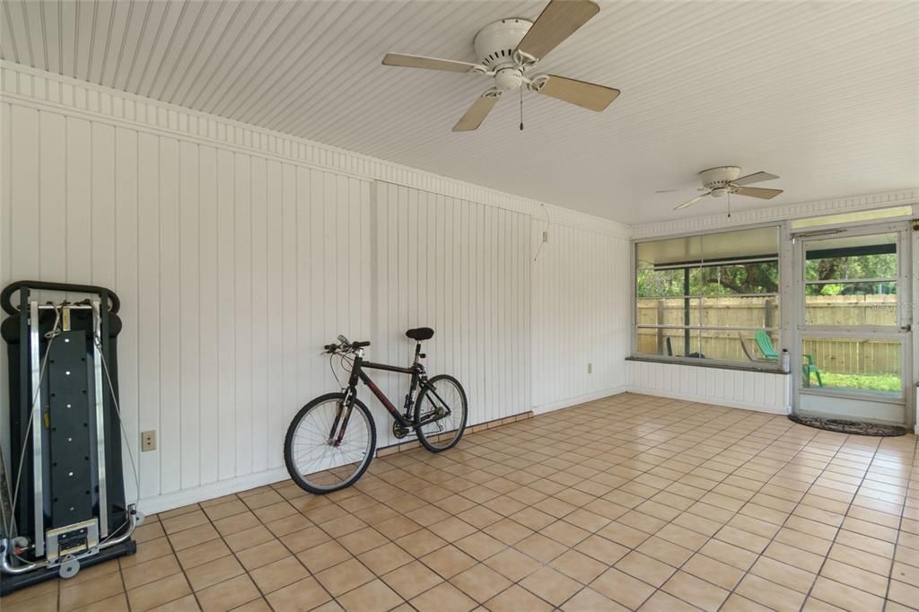 Huge Screened In Porch with Removable Vinyl Windows with Tiled Floors.