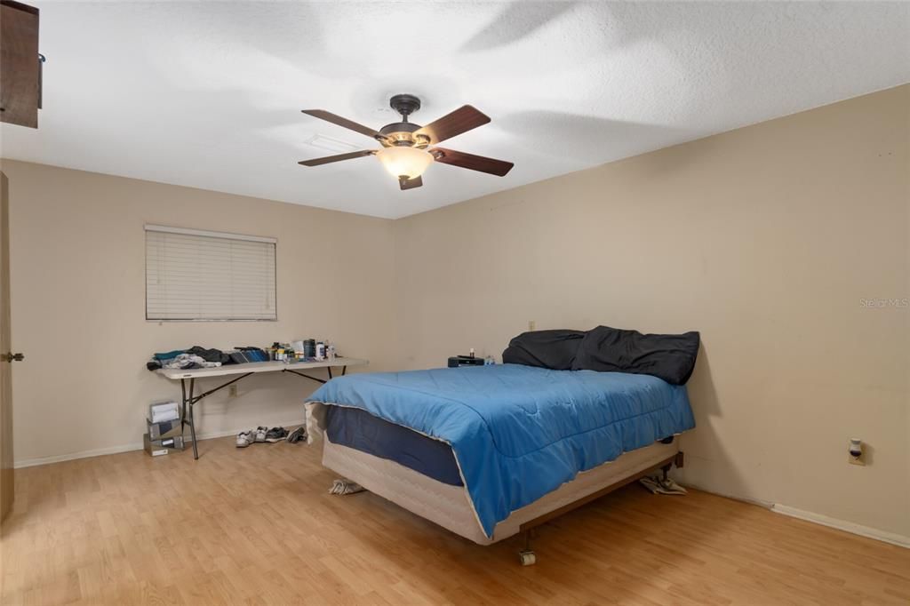 The Master Bedroom is Spacious with a Newer Fan/Light and Walk-In Closet