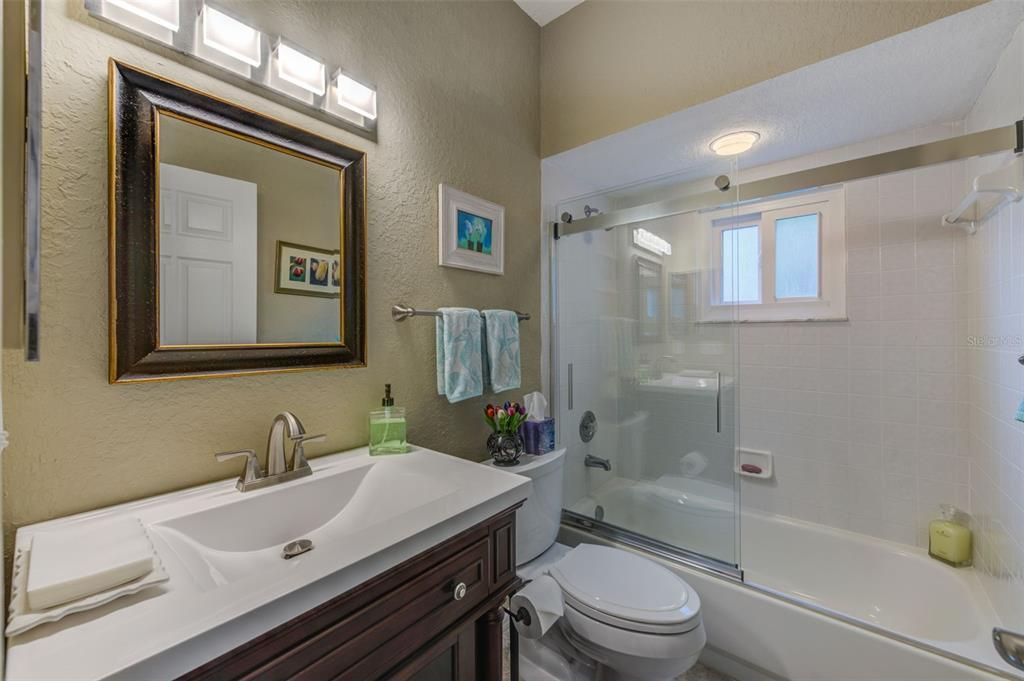 The guest bath on the living/dining/kitchen level is a full bath for the convenience of the guest bedroom on the same level.