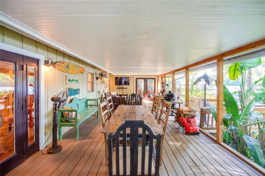 Large attached screened porch overlooking the river