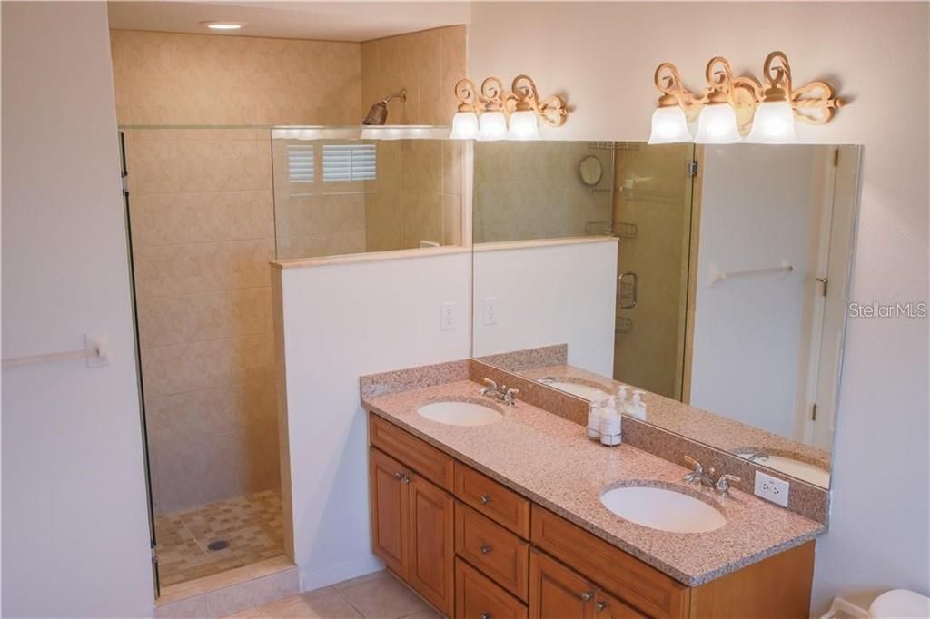Walk-in shower and double vanity in master bathroom