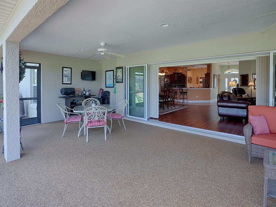 THE HUGE SLIDING GLASS DOORS LEAD FROM THE LIVING AND DINING AREA RIGHT TO OUTDOOR GRILLING AND ENTERTAINING!