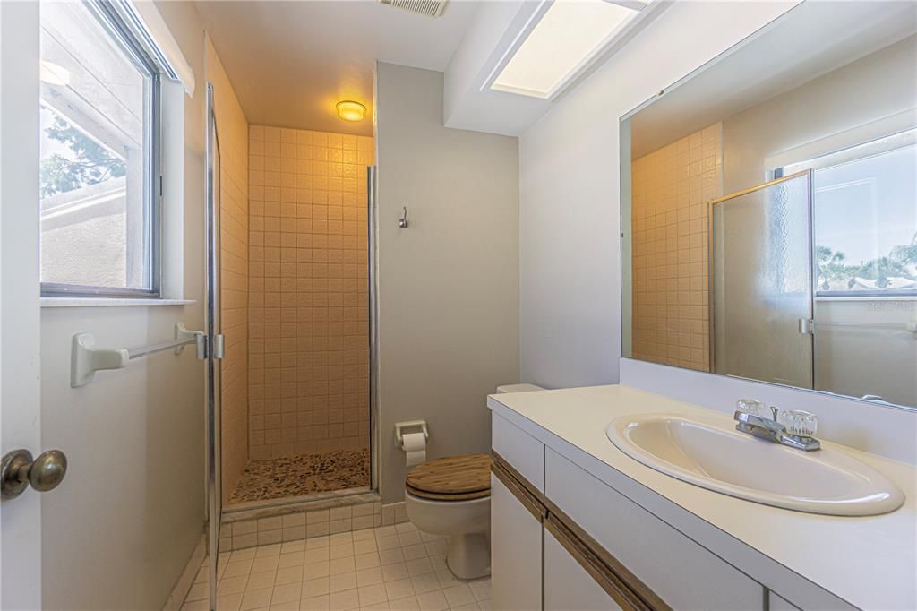 Upstairs full guest bathroom with a stand-up shower.