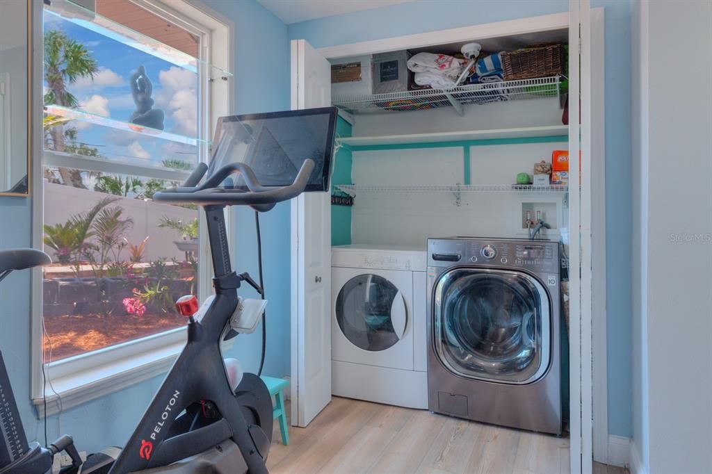 Laundry room with room for gym equipment
