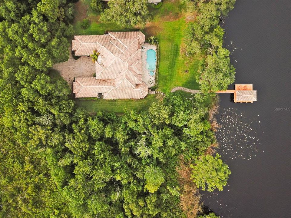 Located on 2+ private acres on Little Lake Howell.