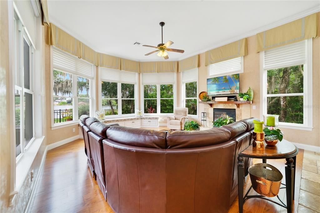 Living area off kitchen with tons of windows to enjoy beautiful views of Little Lake Howell.