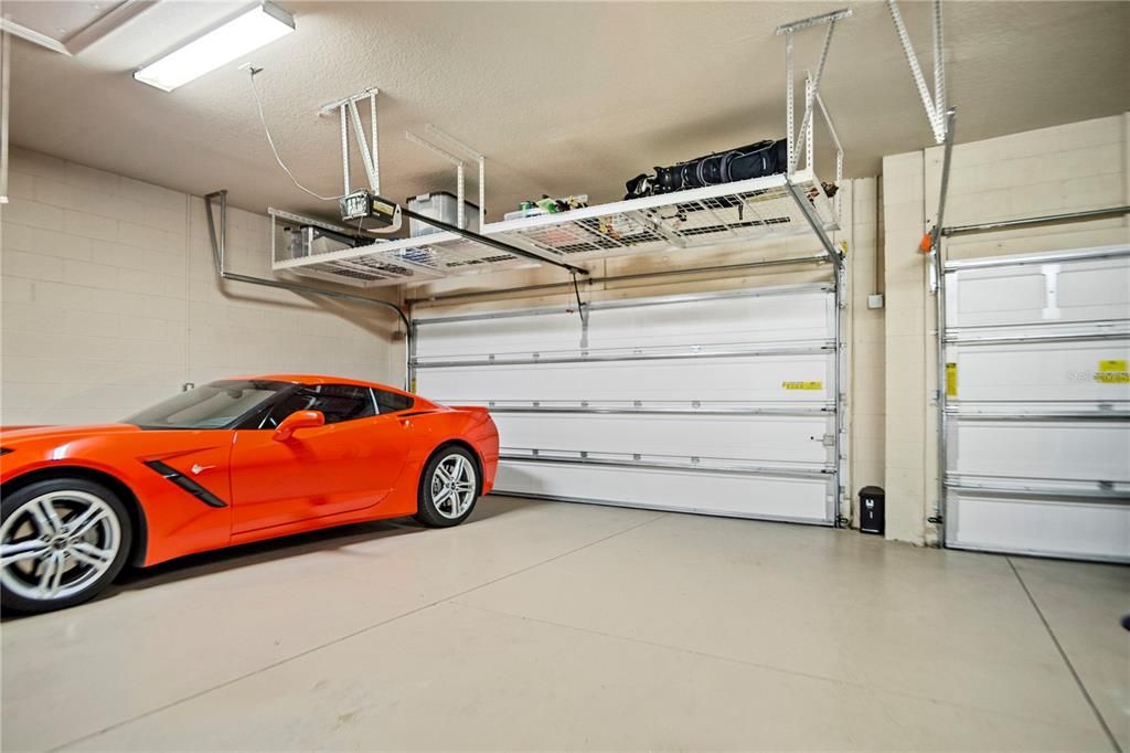 This three car garage has one area that is 24 feet deep, also overhead storage to keep space clear.