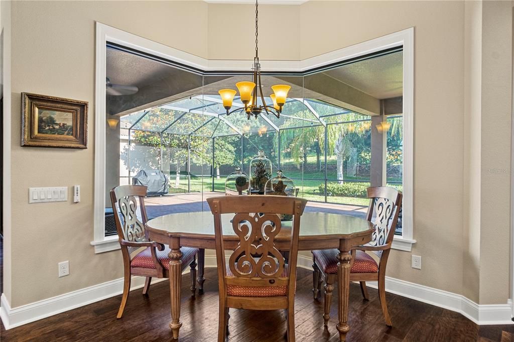 Separate kitchen seating with a huge window open to the lanai.