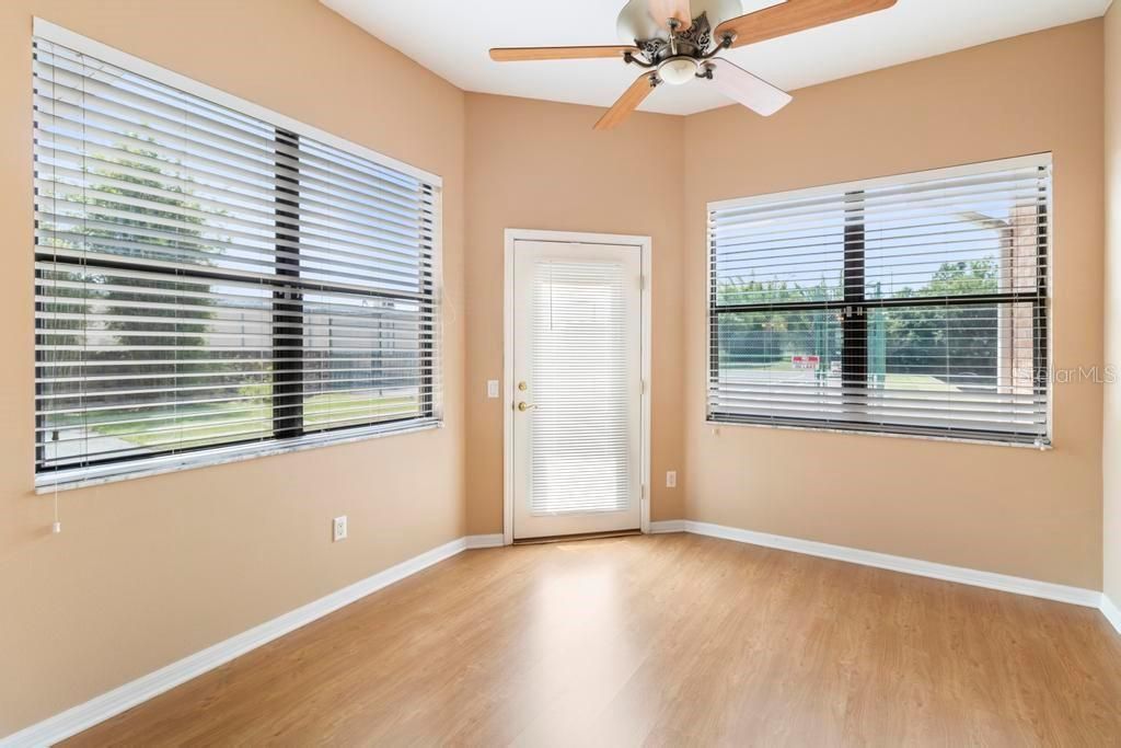 Bonus Room with door leading to back patio/yard area and over to tennis court