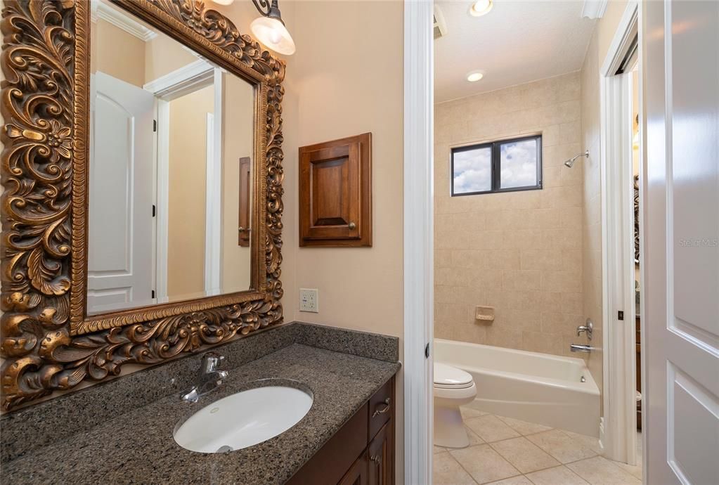 Private vanity for bedroom used as an exercise room and shared Jack n Jill shower area.