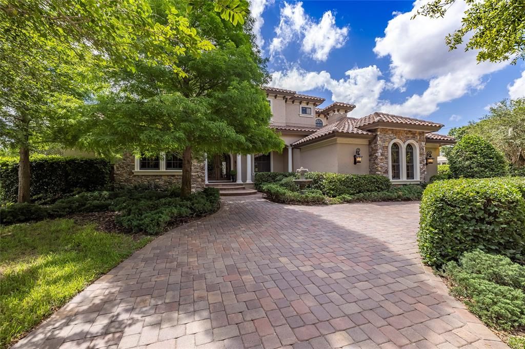 Experience the ambiance of an Italian villa upon entering the beautiful hand forged front doors. This home has exquisite finishes throughout and a grand outdoor living area.  It shows like a new model home!!