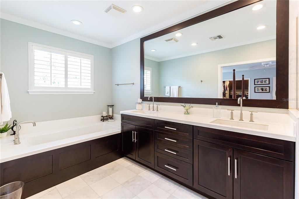 Sleek Spa-Like amenities with soaking tub and dual sinks