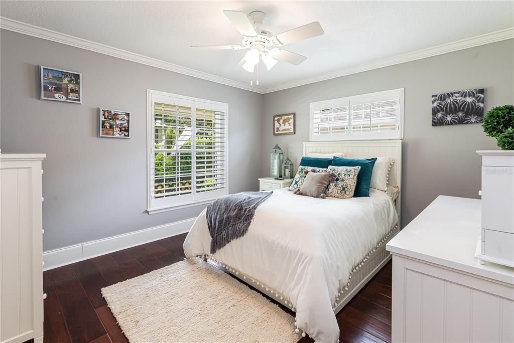 Bedroom #3 located at the front of the house offers plantation shutters