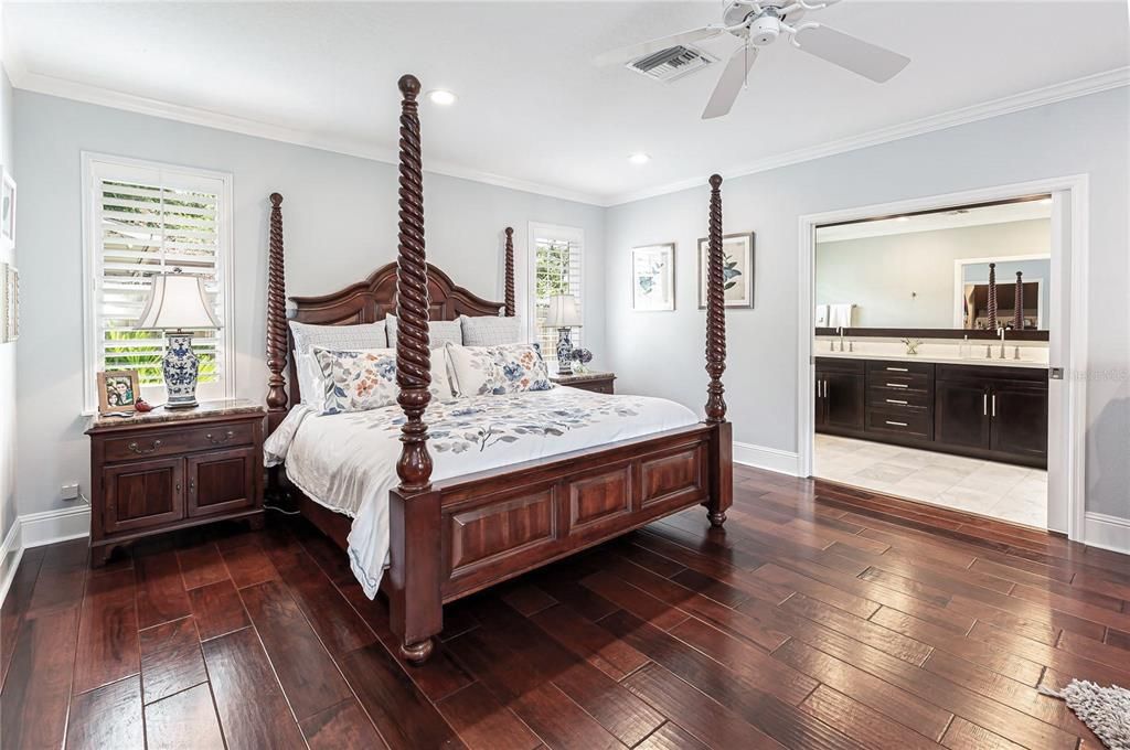 When you want to get away, retreat into your Luxurious Bedroom complete with hardwood flooring, recessed lighting and plantation shutters