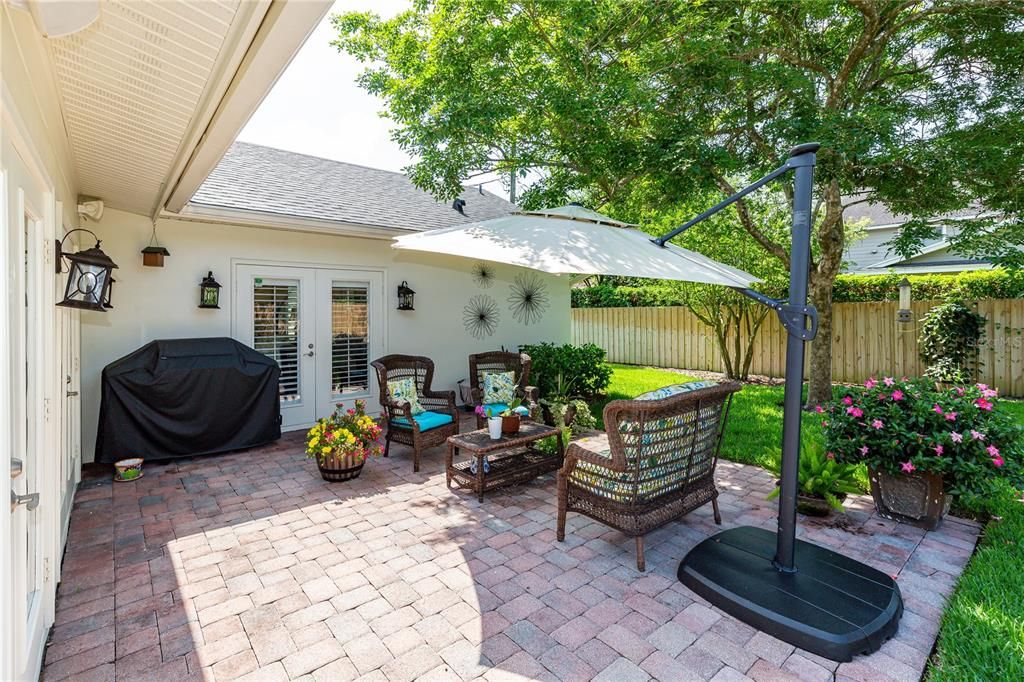 Enjoy mornings and evenings relaxing on your pavered patio overlooking the meticulously maintained backyard.