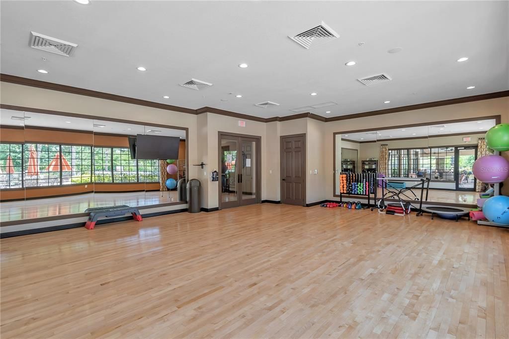 Large fitness room for classes like yoga, Zumba and Pilates.
