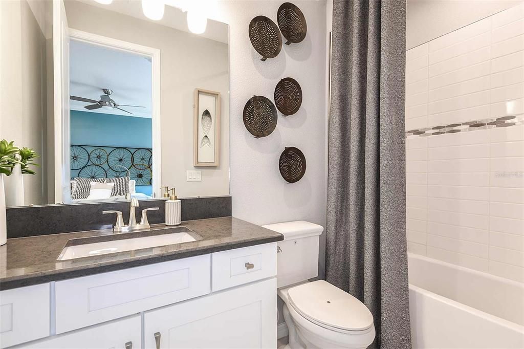 REPRESENTATIVE PHOTO. This en suite secondary bathroom has the perfect touches to relax.