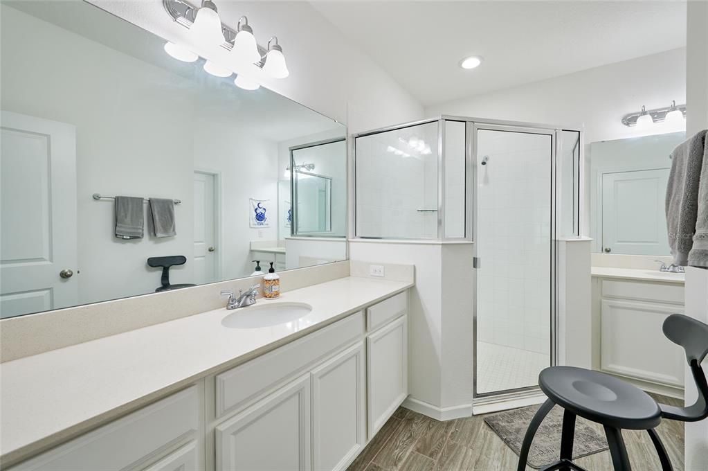 Large master bathroom offers dual sinks and plenty of counter space