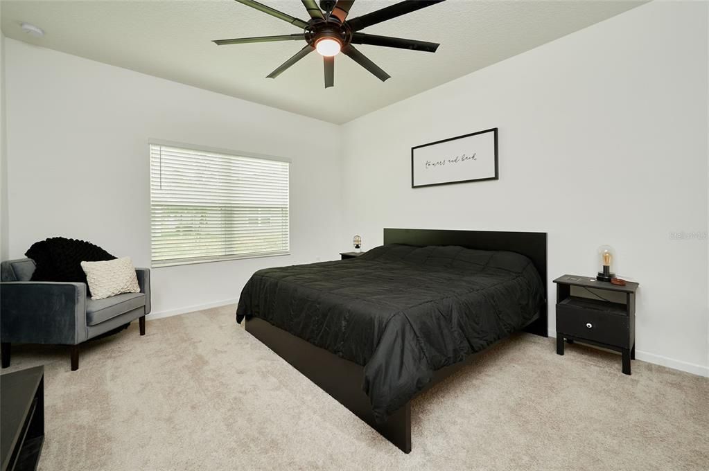Master bedroom features an upgraded fan