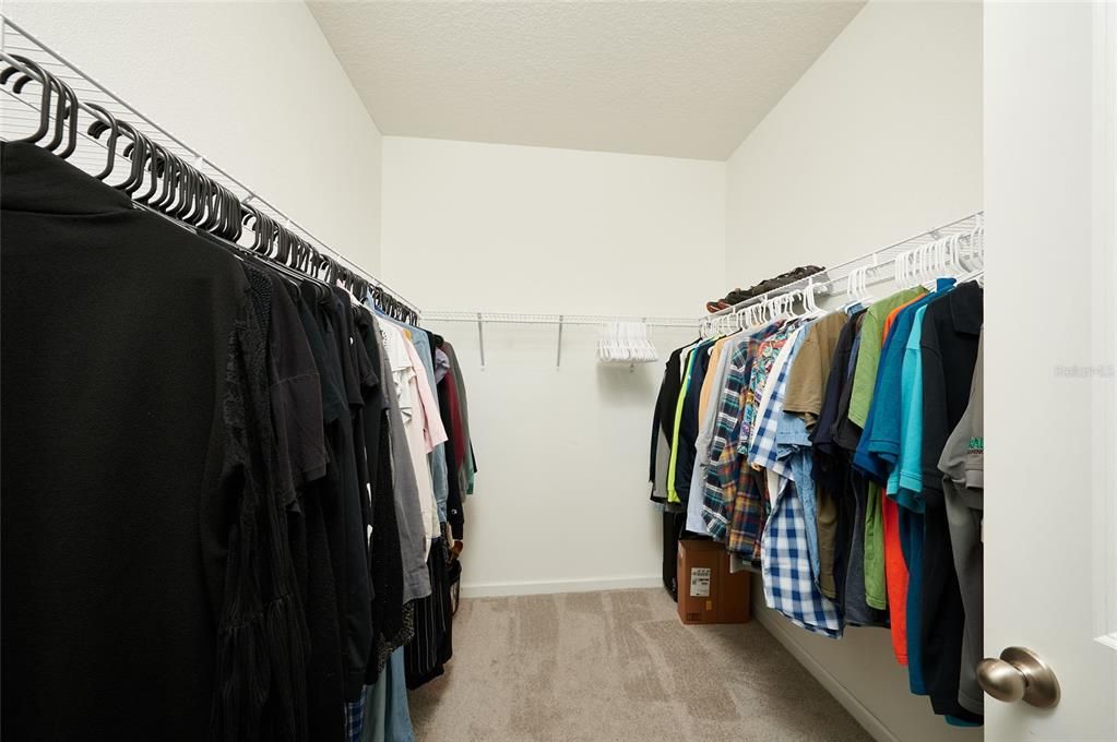 The master suite offers a large walk-in closet
