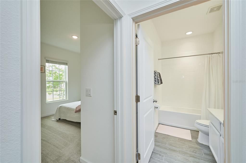 The full guest bath is conveniently located between the front two guest bedrooms