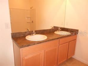 DUAL VANITY IN MASTER BATH, STEP IN SHOWER W/GLASS SHOWER DOORS, PLUS LINEN CLOSET