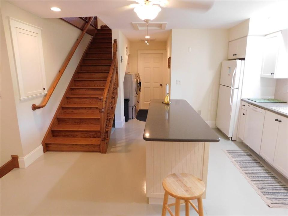 The custom-built, red oak staircase leads to the second floor loft bedroom suite, complete with a full bath and walk-in closet.