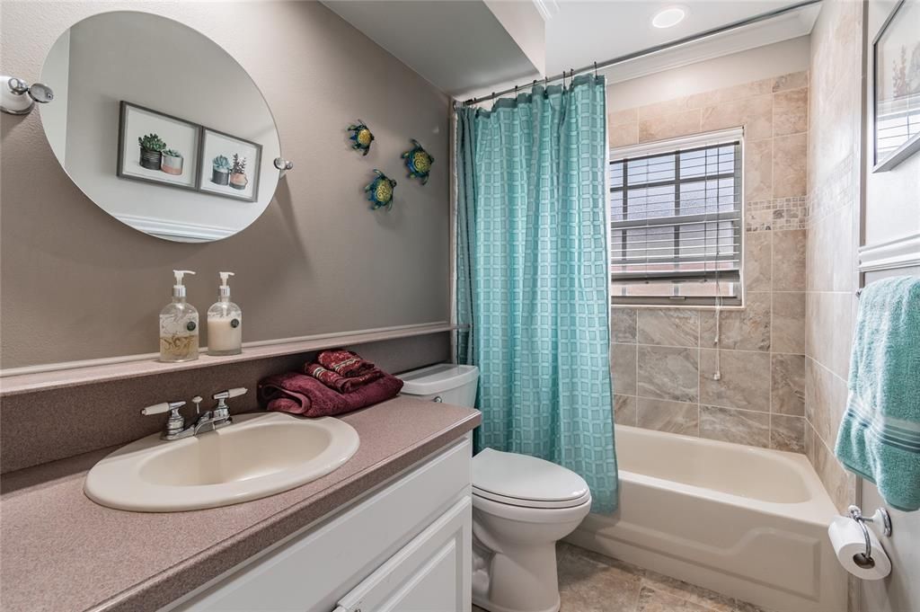 Updated bathroom for the additional 2 bedrooms with shower/tub combo.