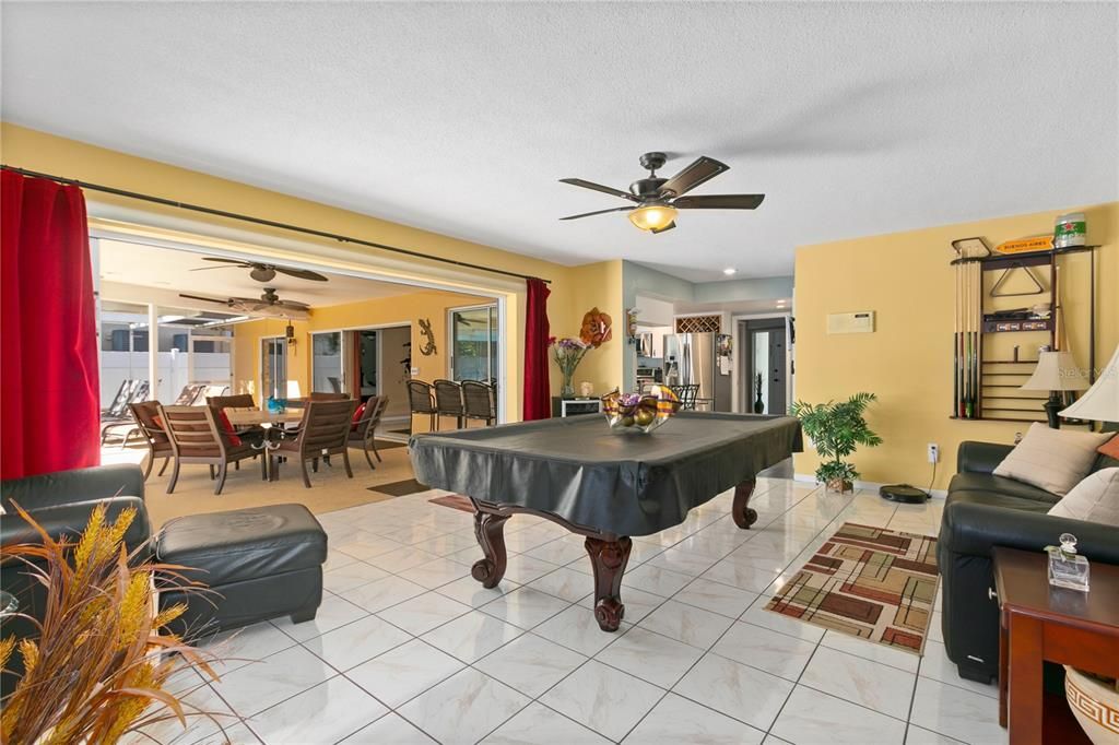 GAME ROOM OFF TO RIGHT OF POOL AREA, DIRECTLY EAST OF HOME ENTRY, AS YOU ENTER HOME, THIS ROOM IS JUST PAST THE KITCHEN