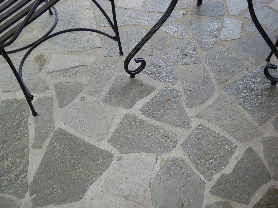 Beautiful flagstone pattern shown on private porch for rear bedroom.