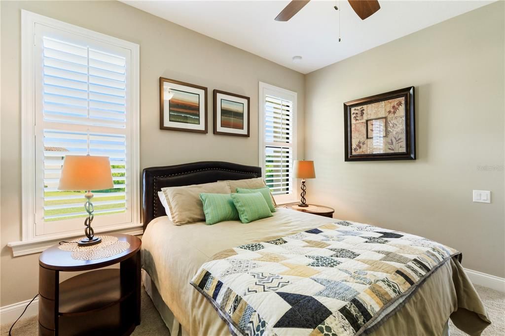 Spacious 3rd bedroom with plantation shutters on both windows