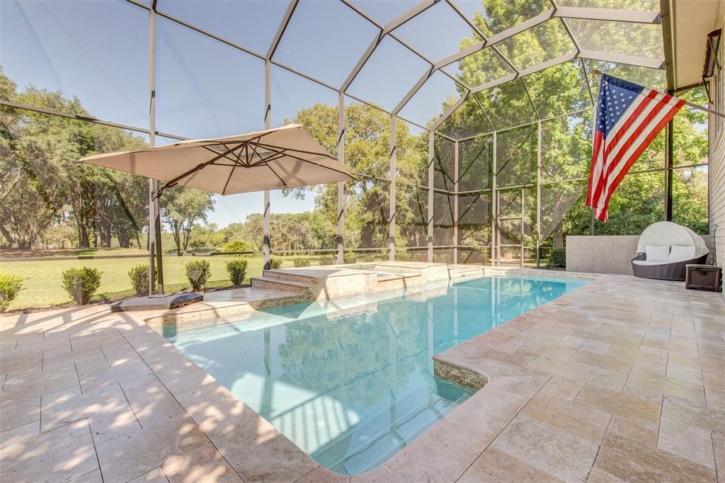 New travertine tile pavers make this pool deck POP!