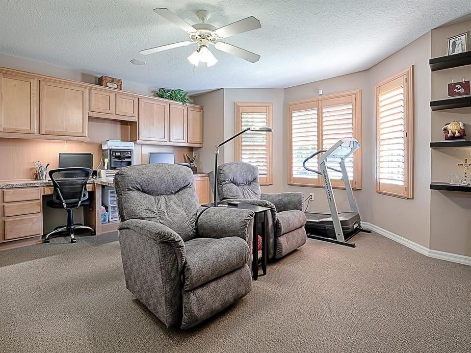 SPACIOUS FRONT GUEST ROOM WITH BUILT-IN CABINETRY AND DOUBLE OFFICE SPACE! PLANTATION SHUTTERS!