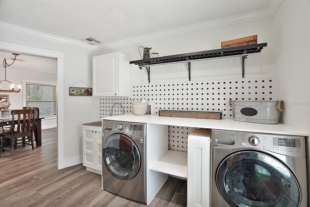 Laundry with folding table and storage