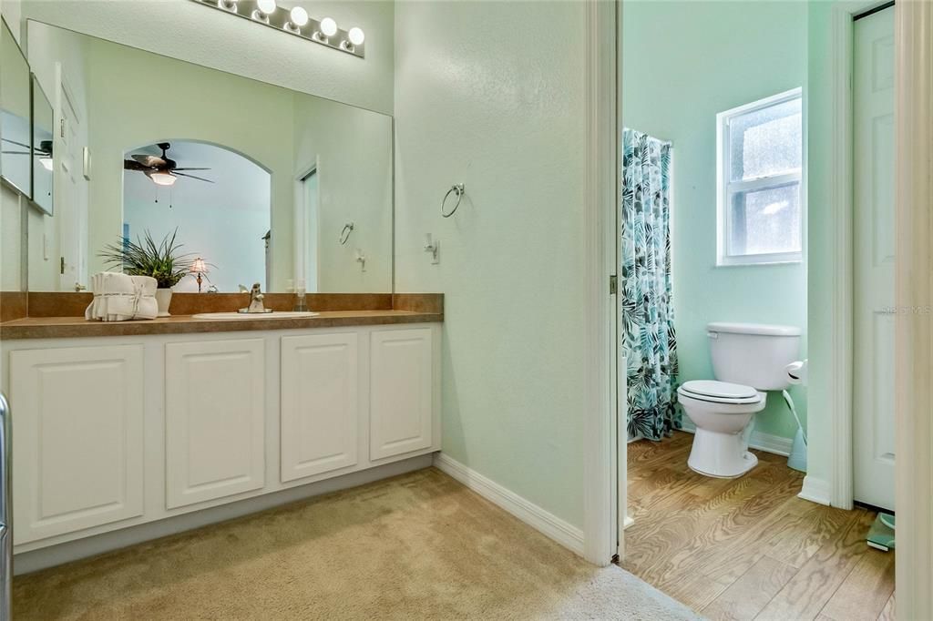 Master Bathroom features a Water Closet, Seated Shower and Linen Closet