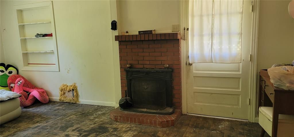 LIVING ROOM WITH WOOD BURNING FIREPLACE