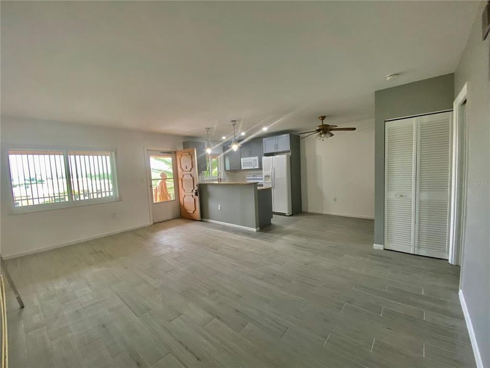 Open floor plan with new Tile Dining Kitchen Living Room New windows face South.