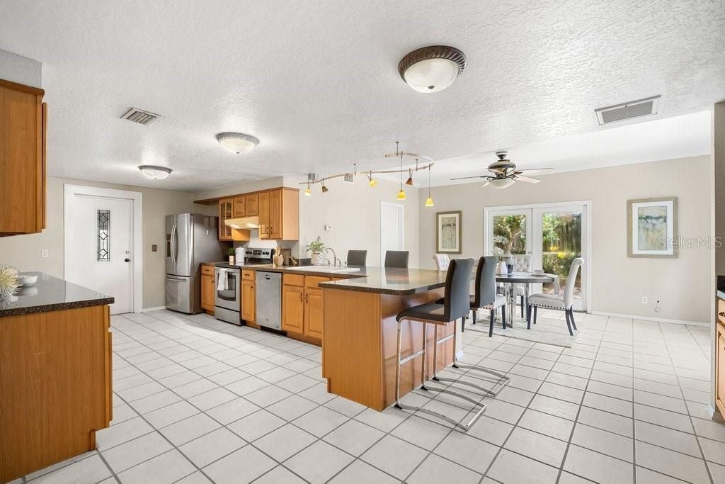 Spacious kitchen with stainless steel appliances and plenty of preparation surfaces.