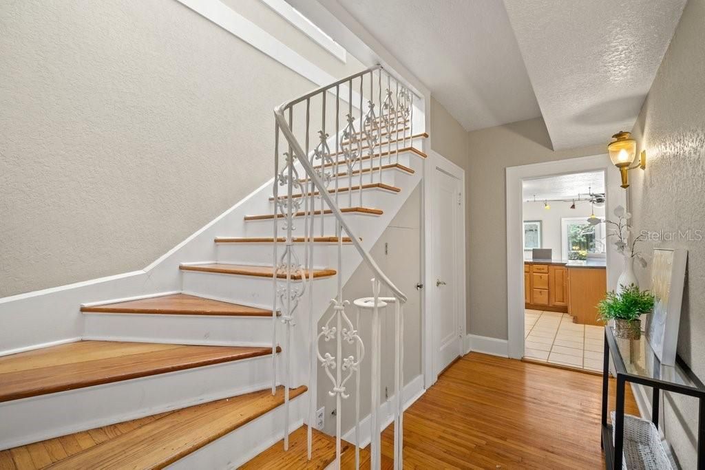 Formal hall with Powder Bath leads you up the staircase to the second level.