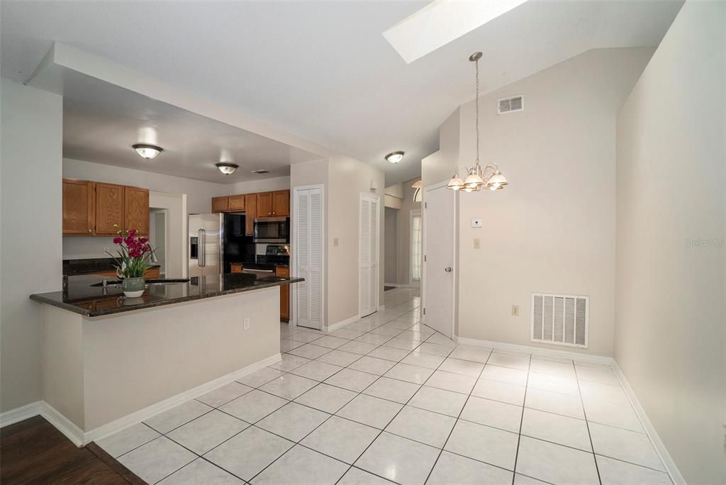 Full view of breakfast bar and kitchen eat-in area