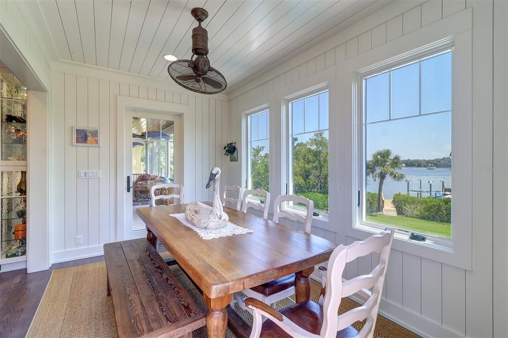 Informal Dining with views of the Anclote River and access to the deck and summer kitchen