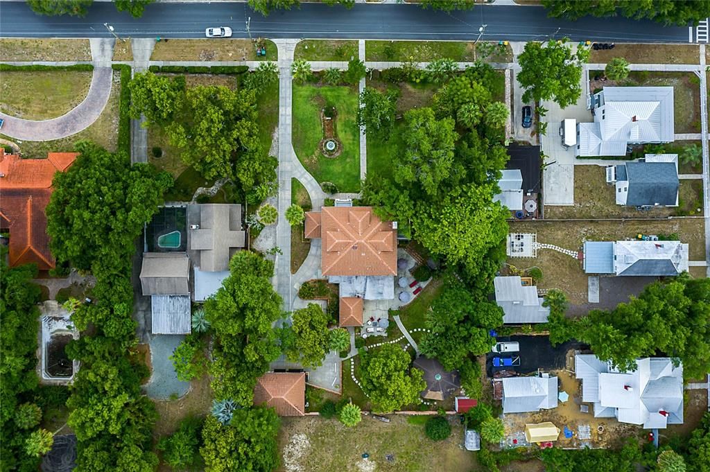 Drone view of the homesite.  The guest cottage is in the lower left corner, cabana is in the lower right corner.  Patios are in back and on the right side.